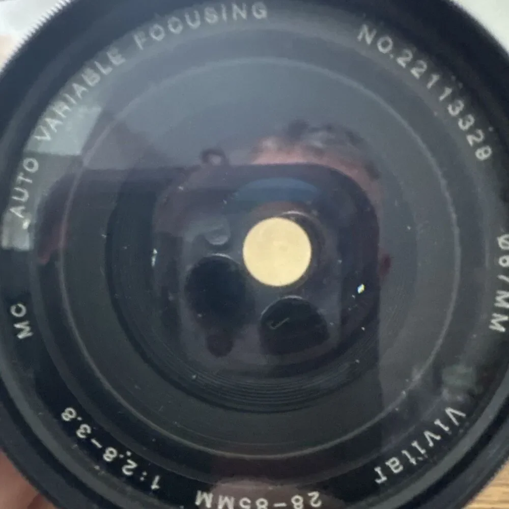 vintage Vivitar 28-85mm f/2.8-3.8 MC macro focusing camera lens.